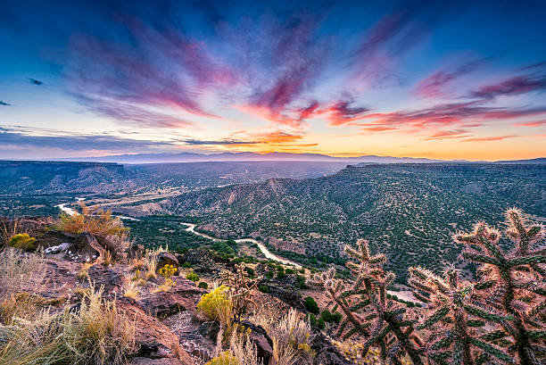 New Mexico Sunrise Over the Rio Grande River Stunning sunrise at Overlook Point near Bandelier, NM new mexico stock pictures, royalty-free photos & images