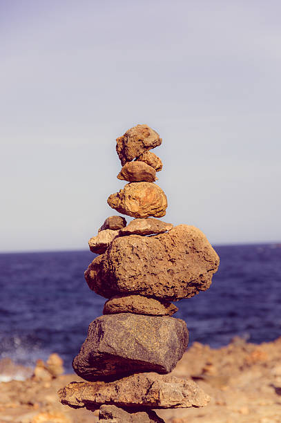 istock Stack of stones on sea shore, Aruba 501625188
