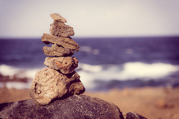 istock Stack of stones on sea shore, Aruba 501625218