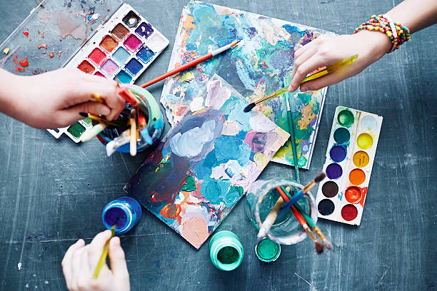Art process Children with paintbrushes beginning to create art and craft equipment photos stock pictures, royalty-free photos & images