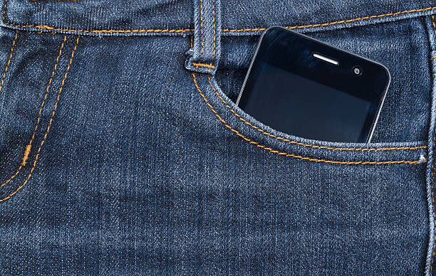 istock Black smartphone in your pocket jeans. background. 501631274