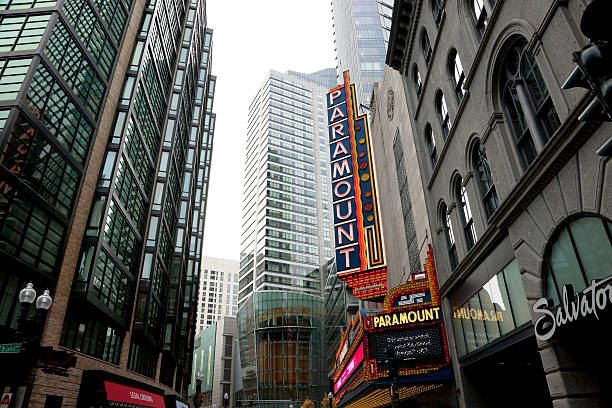 Old Paramount Theater Neon Sign Boston, MA, USA -- December 13, 2015: Old Paramount Theater sign remaining on building which is now owned by a local college . This building is now used to conduct performing arts. paramount studios stock pictures, royalty-free photos & images