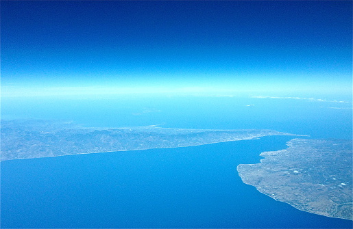 Photo taken from a plane flying from the south-east to the Strait of Messina. Sicily is to the left and Calabria is to the right.