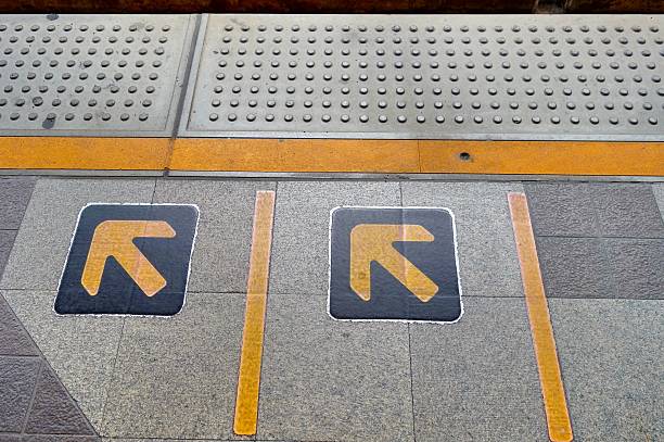 istock Arrow sign on floor at the sky train station 501643762