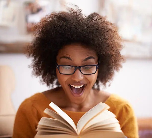 Cropped shot of an attractive young woman looking excited while reading a bookhttp://195.154.178.81/DATA/i_collage/pi/shoots/783559.jpg