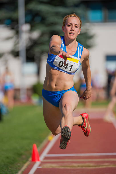 istock Young Female Athlete at Triple Jump Competition 501644631
