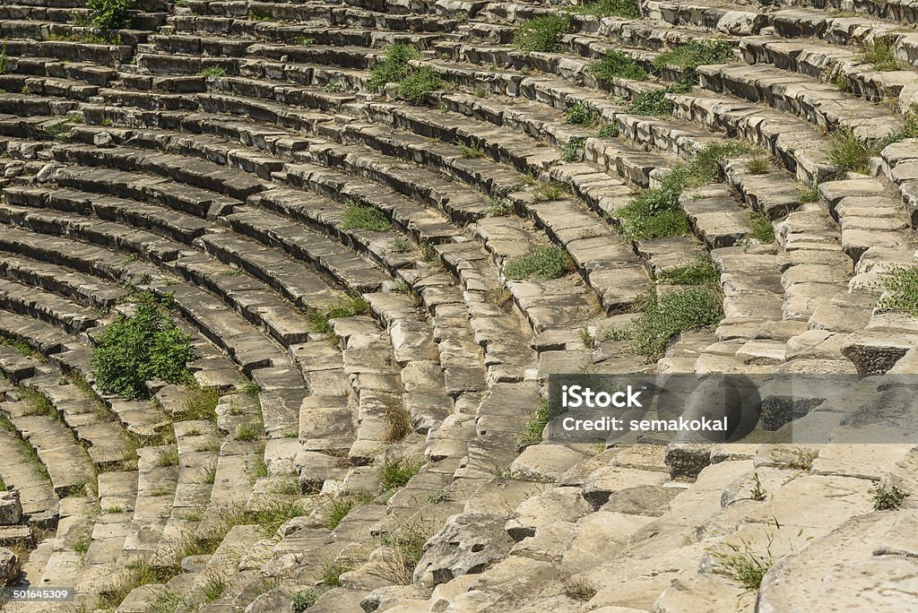 Aphoridisias Famous ruin landmark in the Aphrodisias amphitheater in Turkey. Green spring landscape. Amphitheater Stock Photo