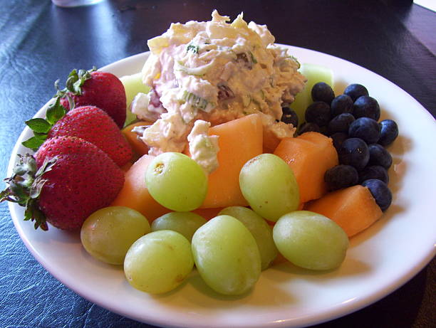 istock Plate of Chicken Salad with Colorful Fruit and Melons 501646111