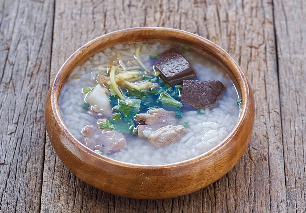 istock Rice porridge with pork ribs on wood background 501646500