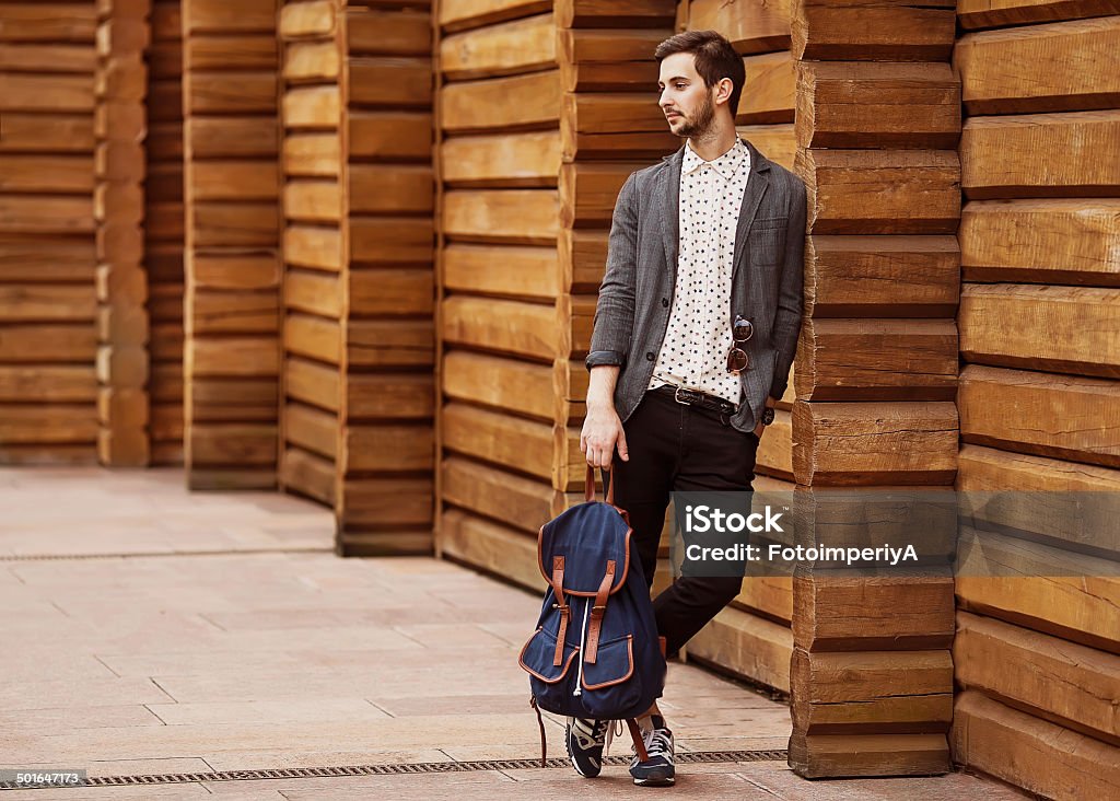 Hipster style guy Portrait of young beautiful fashionable man against wooden wall. Hipster style guy Adult Stock Photo