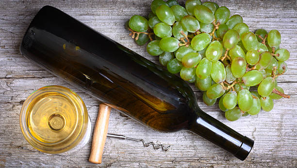 istock wine bottle, grapes and a glass of wine 501647612