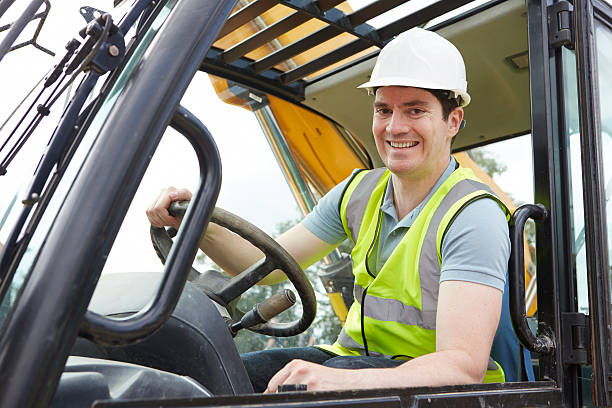 istock Portrait Of Construction Worker Driving Digger 501647719