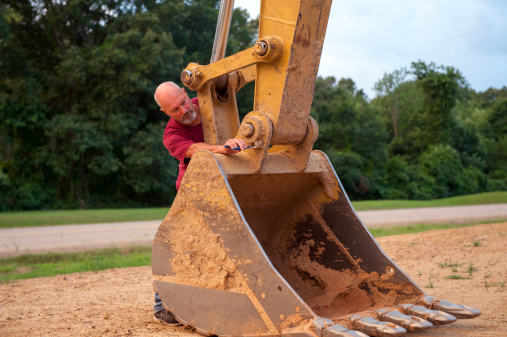 Man Operating Backhoe Man Working On Backhoe Bucket Stock Photo - Download Image Now - Men ...