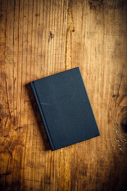 istock Black notebook on wooden office desk 501648826