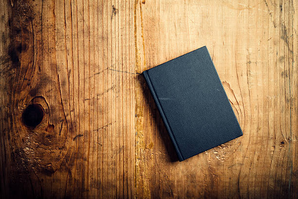 istock Black notebook on wooden office desk 501648972