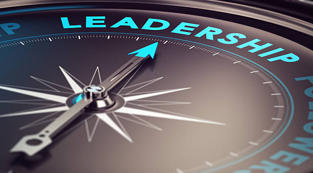 Leadership Compass with needle pointing the word leadership with blur effect plus blue and black tones. Conceptual image for illustration of leader motivation leading stock pictures, royalty-free photos & images