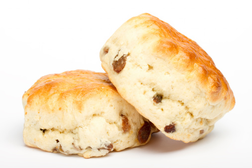 Two fruit scones on a white background