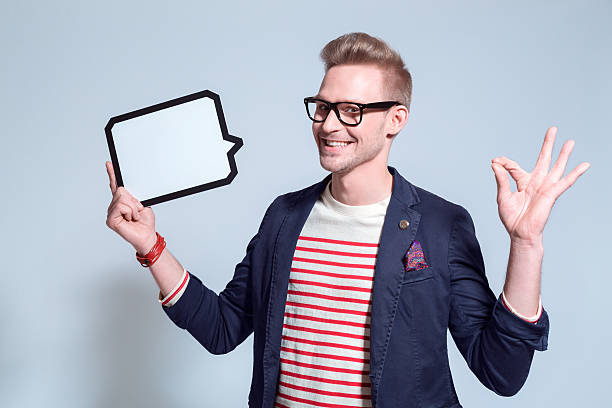 istock Excited blonde young man holding a speech buble 501650716