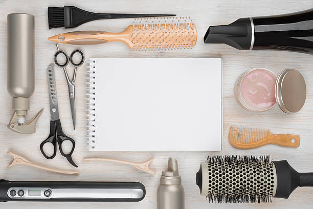 istock Hairdressing tools on wooden background with blank sheet in centre 501653536