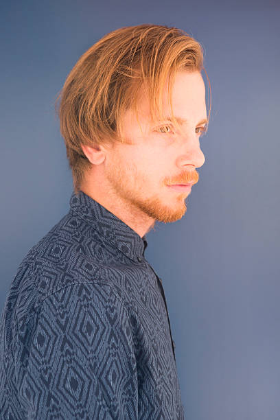 istock portrait of red-haired young man 501655080