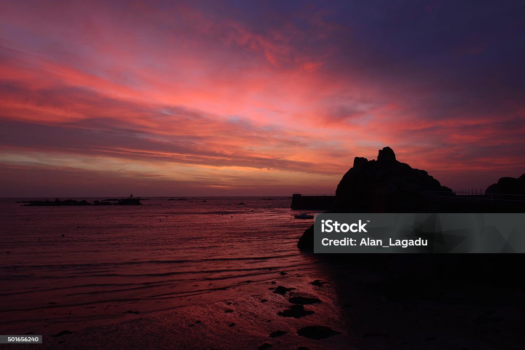 La Rocque Harbour, Jersey, U.K. Wide angle coastal Winter sunrise. Beach Stock Photo