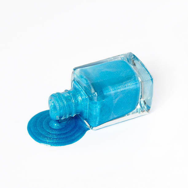istock blue nail polish dripping on white background 501665360