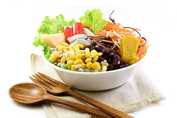 istock Salad and wood spoon, fork on cloth 501665537