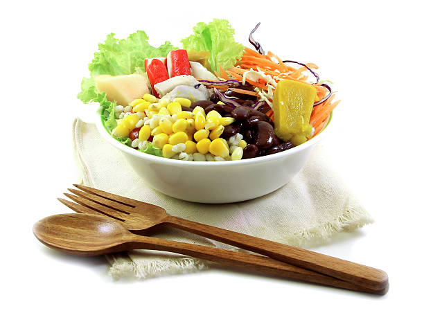 istock Salad and wood spoon, fork on cloth 501665539