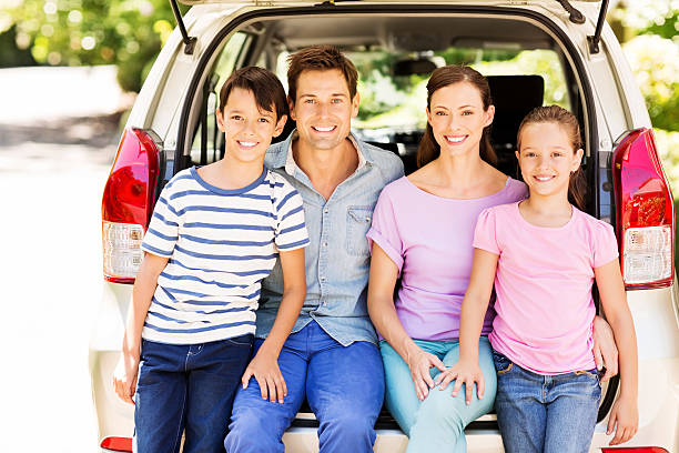istock Happy Two Generation Family Sitting In Car Trunk 501665719