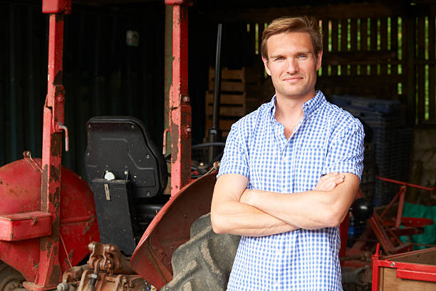 istock Portrait Of Farmer With Old Fashioned Tractor 501665775