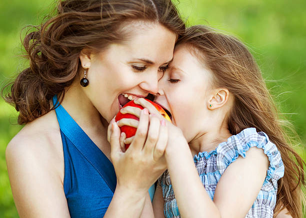 istock Mother and daughter in park 501667063