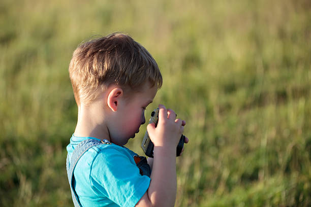 istock Little boy with camera outdoor 501667167