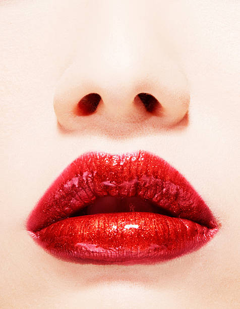 istock Beautiful lips with lipstick and lipgloss. Closeup. 501667214