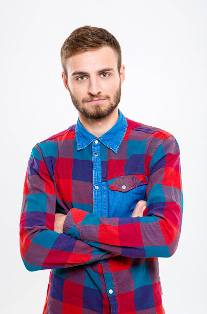 istock Serious casual man standing with arms folded 501670104