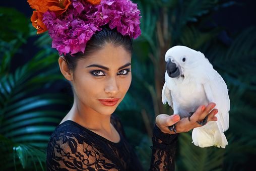 Shot of an exotic looking woman with a parrot perched on her handhttp://195.154.178.81/DATA/i_collage/pi/shoots/783575.jpg