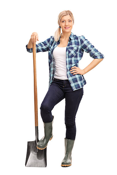 istock Female agricultural worker posing with a shovel 501670864
