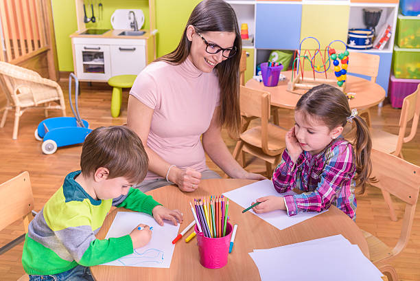 Mother explaining preteen son how to solve equation when they are doing homework together