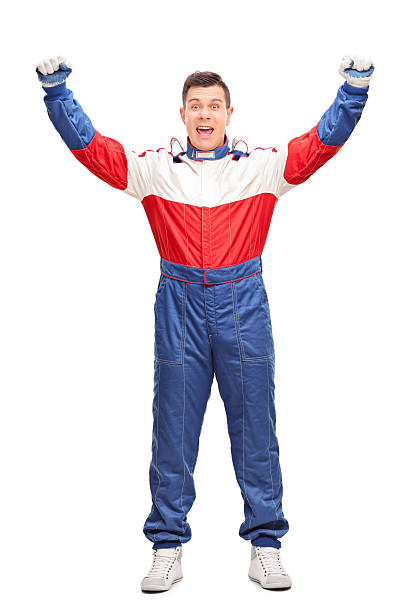 Overjoyed car racer gesturing happiness Full length portrait of an overjoyed car racer gesturing happiness isolated on white background race car driver stock pictures, royalty-free photos & images