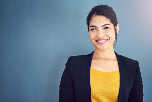 Cropped studio portrait of a young businesswoman standing against a gray backgroundhttp://195.154.178.81/DATA/i_collage/pi/shoots/806155.jpg