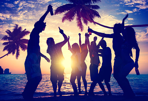 istock People Enjoying Party by the Beach 501672449