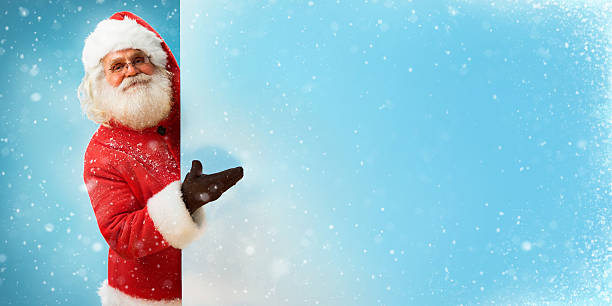 istock Santa Claus holding copyspace blank sign for Your Text 501672506