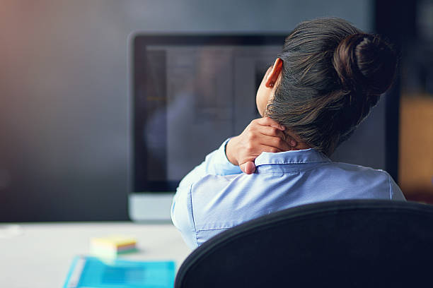 Too many hours in front of the computer... Rearview shot of a businesswoman suffering from neck pain at the officehttp://195.154.178.81/DATA/i_collage/pi/shoots/806127.jpg neck stock pictures, royalty-free photos & images