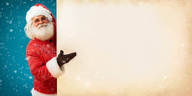 istock Smiling Santa Claus holding old paper banner 501672912