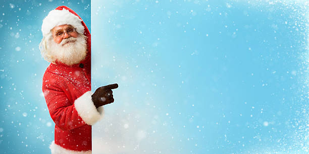 istock Santa Claus holding banner with blue space for Your Text 501672982
