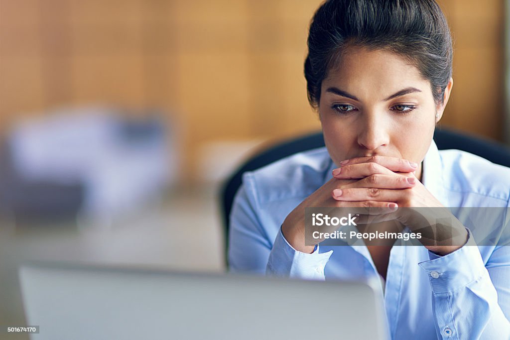 It's been a long day... Shot of a young businesswoman looking stressed while working on her laptophttp://195.154.178.81/DATA/i_collage/pi/shoots/806127.jpg Contemplation Stock Photo