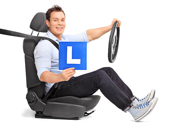 istock Man holding an L-sign seated on a car seat 501676326