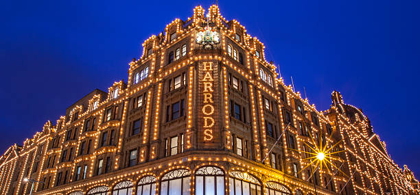 Harrods in London London, UK - December 16, 2015: A view of the iconic Harrods department store in London on 16th December 2015. harrods photos stock pictures, royalty-free photos & images
