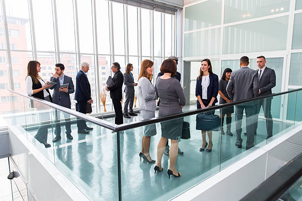 istock Large group of business people standing and talking 501679914