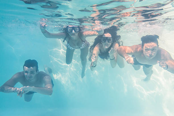 istock Boys and girls swim underwater 501691399