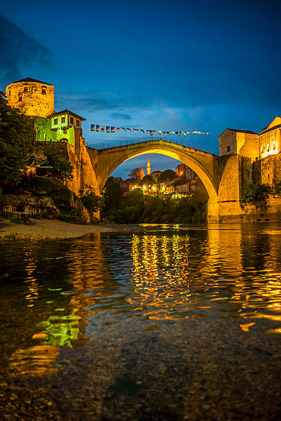Night photograph of the Mostar bridge. Neretva, the Old bridge and both banks where old settlement is built. 